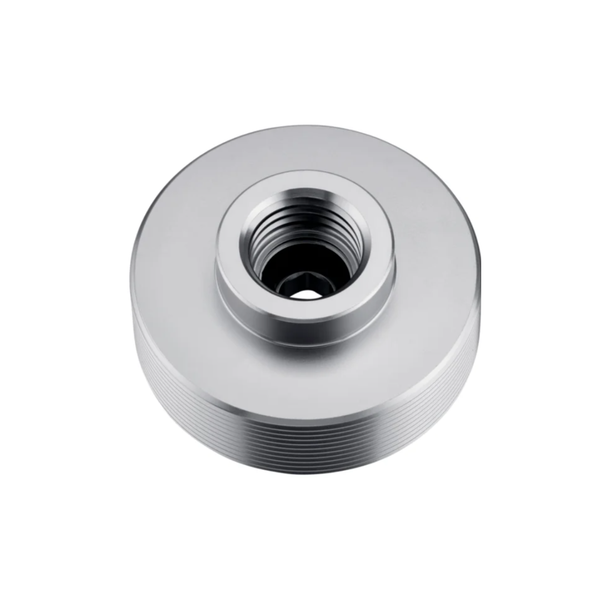 A silver metallic cylindrical threaded component, likely a machined metal fitting or adapter, shown from a top-down perspective on a solid white background.