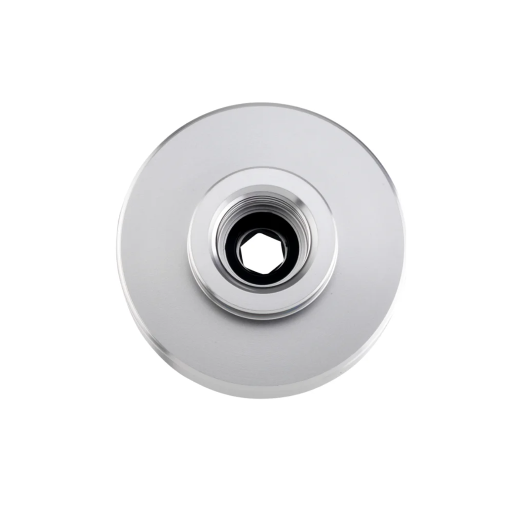 A round metallic silver hardware component with a central hexagonal threaded opening, shown on a plain white background.